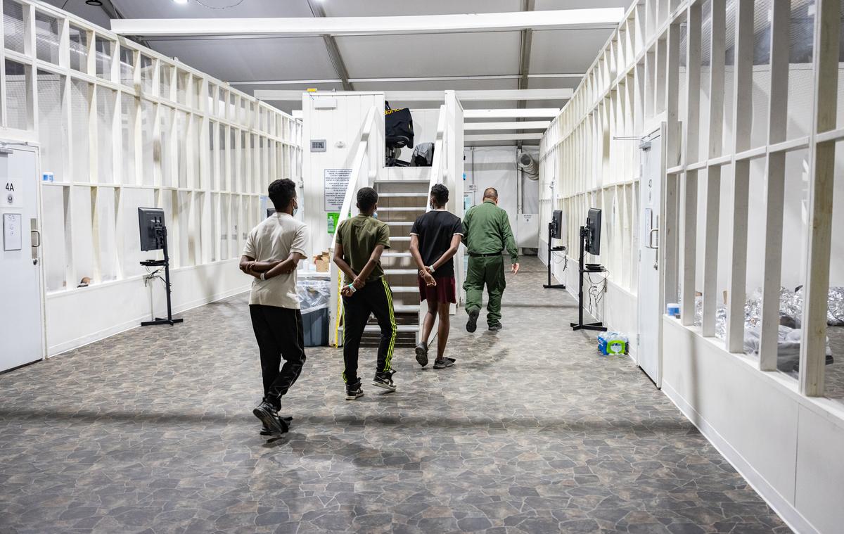 Migrants captured by U.S. Border Patrol agents go through a processing center near San Diego on May 31, 2023. (John Fredricks/The Epoch Times)