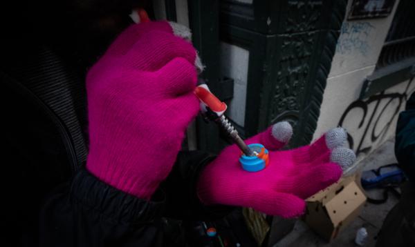  A man prepares to heat fentanyl in San Francisco, Calif., on Feb. 22, 2023. (John Fredricks/The Epoch Times)