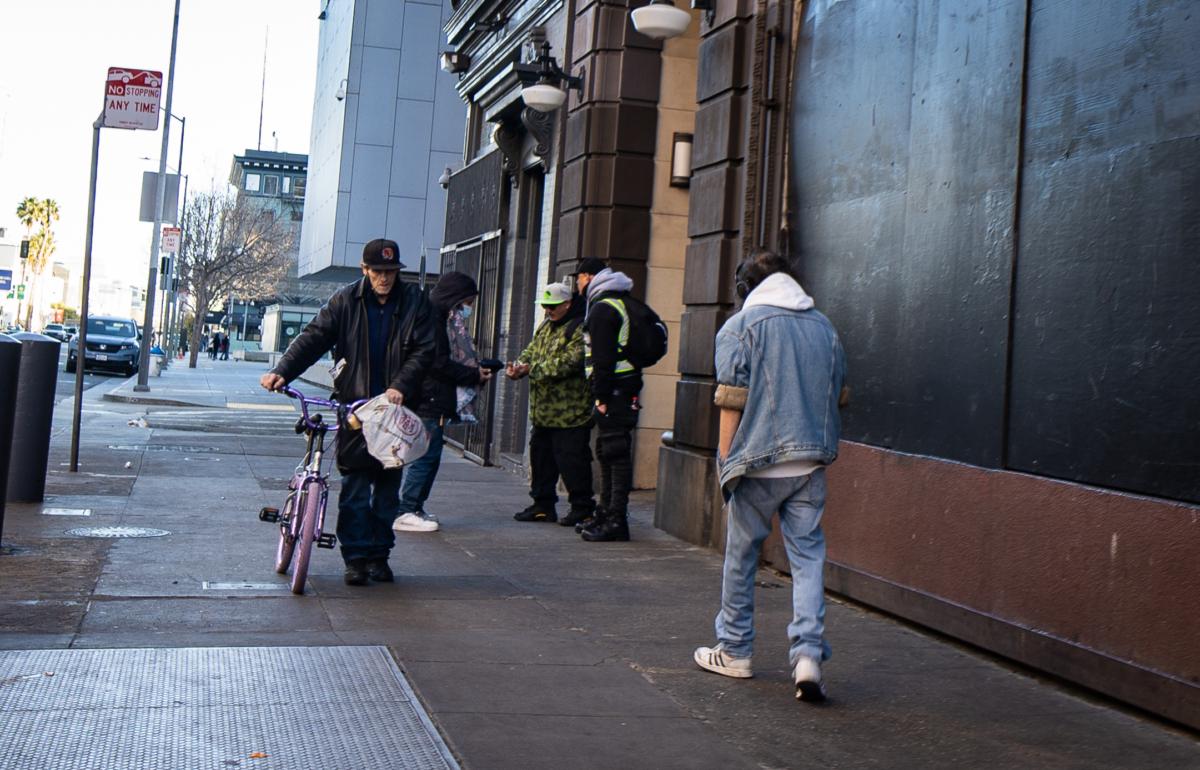 Homeless individuals walk in San Francisco on Feb. 23, 2023. (John Fredricks/The Epoch Times)