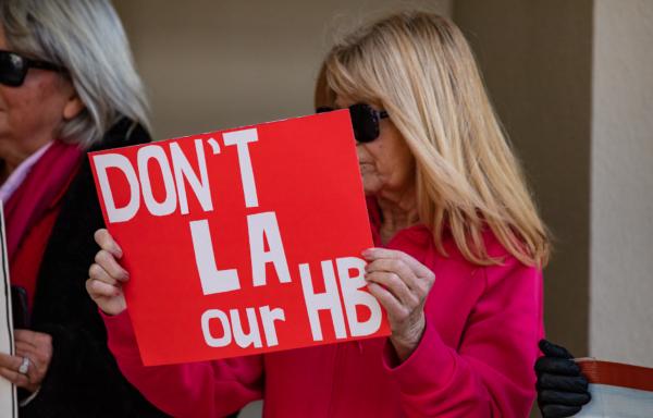 Opponents of housing mandates meet with city officials in Huntington Beach, Calif., on Feb. 14, 2023. (John Fredricks/The Epoch Times)