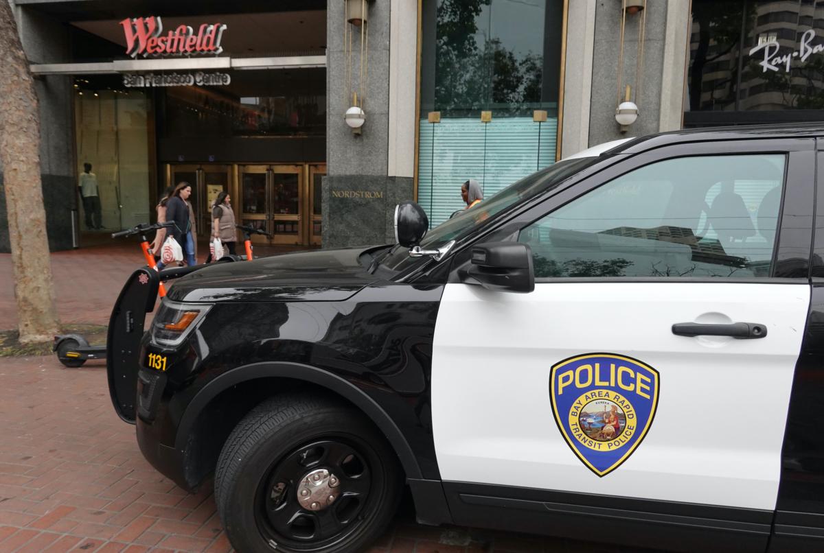 A police car sits parked in front of a mall in San Francisco on June 14, 2023. (Justin Sullivan/Getty Images)