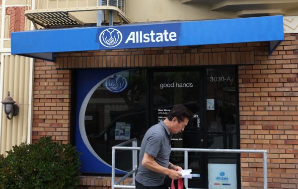  A pedestrian walks by an Allstate Insurance office in San Francisco on June 9, 2023. Allstate Insurance is following the lead of State Farm Insurance and discontinuing homeowners insurance for California residents. (Justin Sullivan/Getty Images)