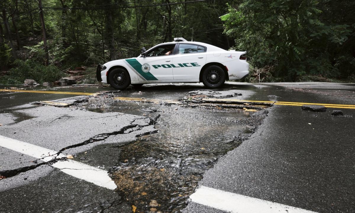 A severely damaged road is closed near Bear Mountain State Park following a night of heavy rain and flooding in Highland Falls, New York, on July 10, 2023. (Spencer Platt/Getty Images)