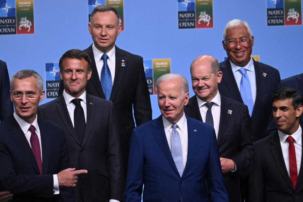 Participants of the NATO Summit—including (L-R) NATO Secretary General Jens Stoltenberg, French President Emmanuel Macron, U.S. President Joe Biden, German Chancellor Olaf Scholz, and Britain's Prime Minister Rishi Sunak—pose for an official photo in Vilnius, Lithuania, on July 11, 2023. (Andrew Caballero-Reynolds/Pool/AFP via Getty Images)