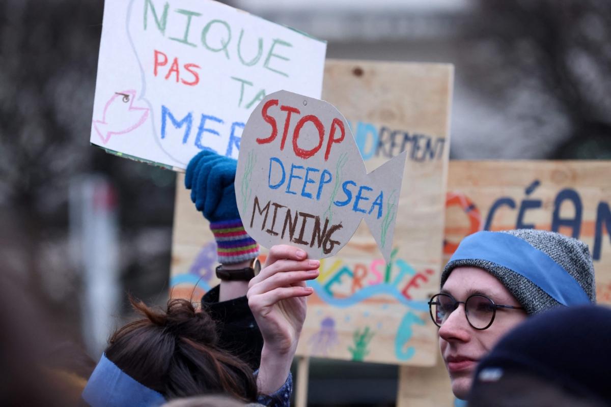 Activists take part in a rally to stop deep-sea mining outside the European Parliament in Brussels on March 6, 2023. (Kenzo Tribouillard/AFP via Getty Images)