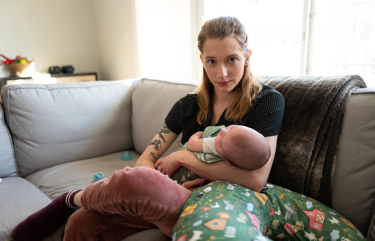 Detransitioner Daisy Strongin enjoys her newborn son in northeastern, Illinois, on Nov. 1, 2022. (John Fredricks/The Epoch Times)