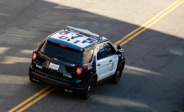 An LAPD car patrols downtown Los Angeles on Jan 6, 2022. (John Fredricks/The Epoch Times)