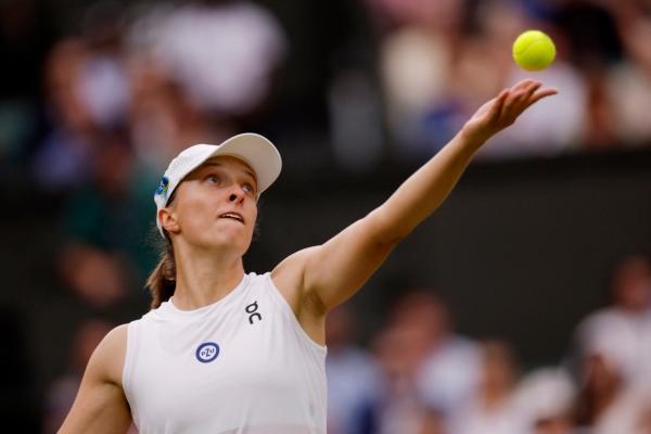 Poland's Iga Swiatek in action during her quarter final match against Ukraine's Elina Svitolina during the Tennis Wimbledon at All England Lawn Tennis and Croquet Club in London on July 11, 2023. (Andrew Couldridge/Reuters)