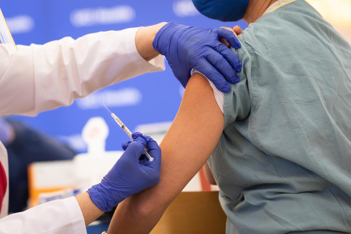 UCI medical staff recieve a COVID-19 vaccination in Orange, Calif., on Dec. 16, 2020. (John Fredricks/The Epoch Times)