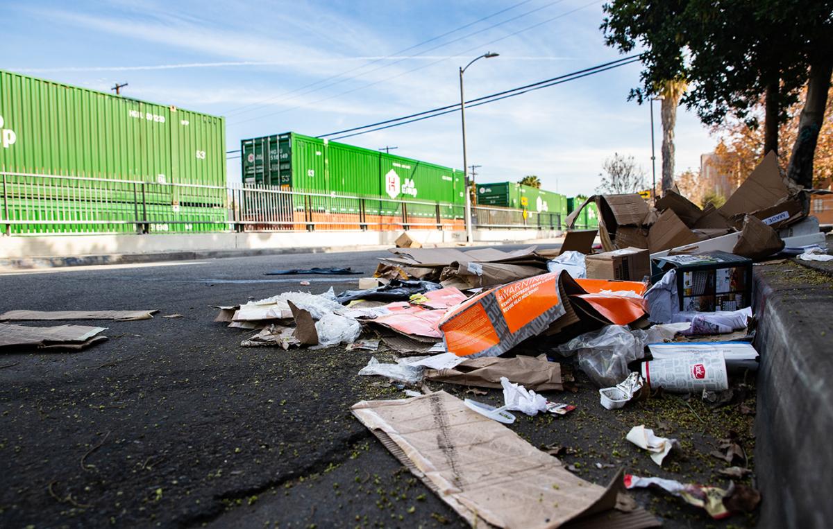 Empty boxes lay scattered near the roadroad tracks after ongoing train robberies in the Lincoln Heights neighborhood of Los Angeles on Jan. 14, 2022. (John Fredricks/The Epoch Times)