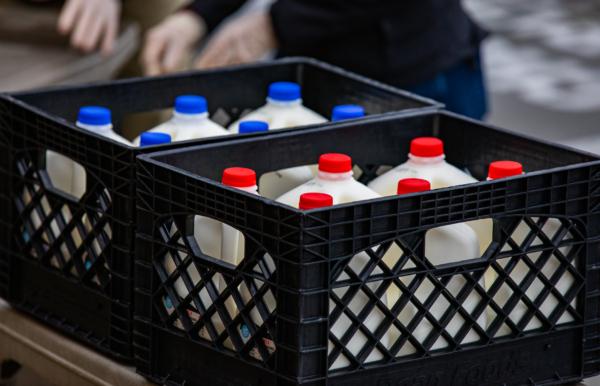 A crate of milk sits ready for food donations in Laguna Niguel, Calif., on Dec. 23, 2021. (John Fredricks/The Epoch Times)