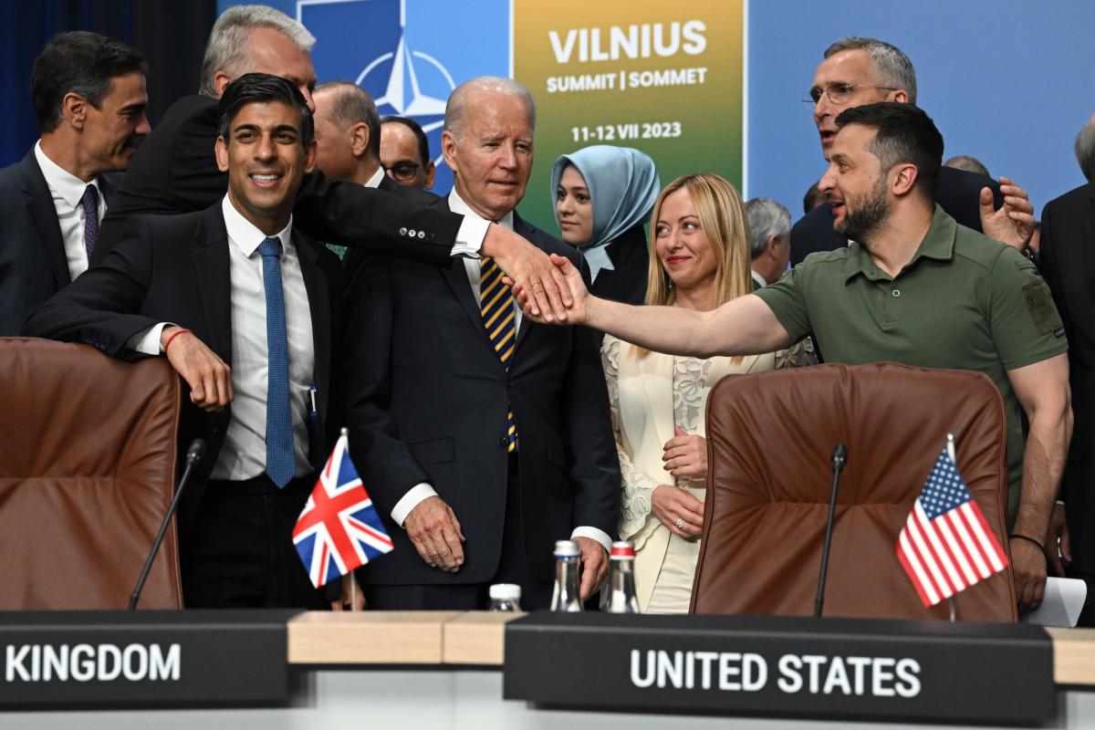 Ukraine's President Volodymyr Zelensky (R) shakes hands with Lithuania's President Gitanas Nauseda (2L) behind the United Kingdom's Prime Minister Rishi Sunak (L), U.S. President Joe Biden (C) at a meeting of the NATO-Ukraine Council during the NATO Summit in Vilnius, Lithuania, on July 12, 2023. (Paul Ellis/Pool/Getty Images)