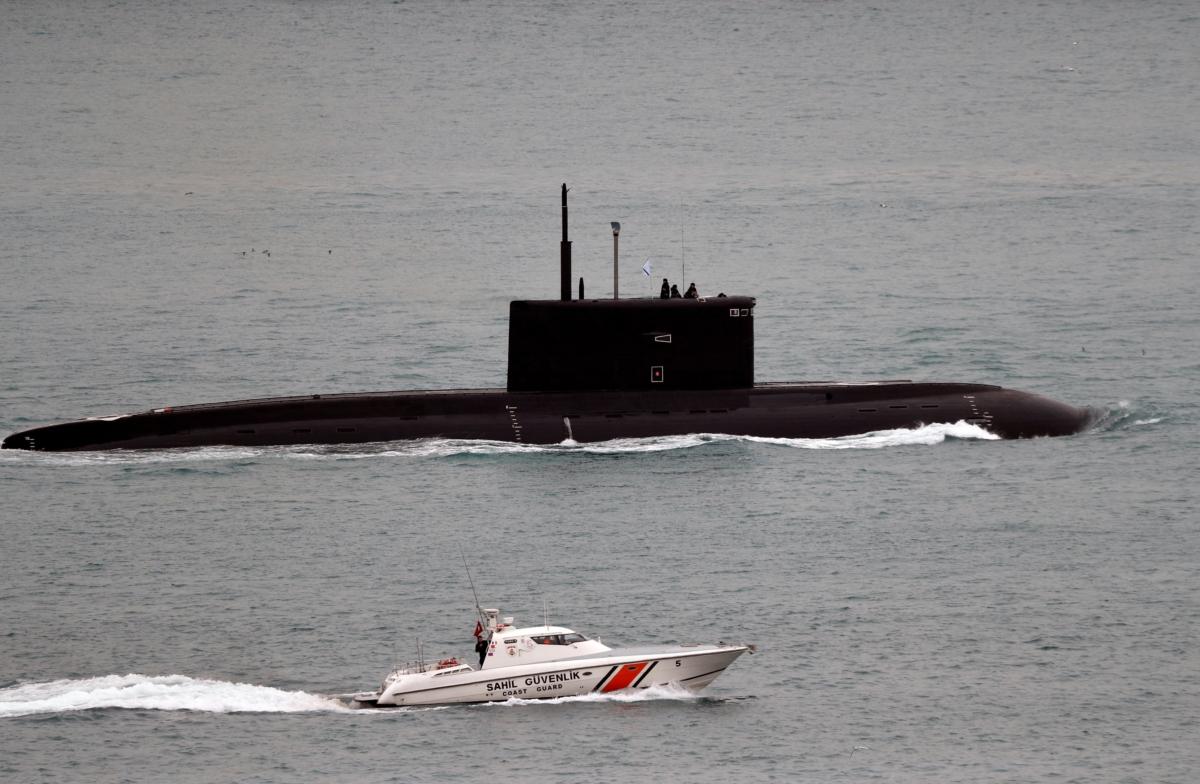 A Turkish Coast Guard boat escorts the Russian Kilo-class diesel-electric submarine Krasnodar as it sails in the Bosporus on its way to the Mediterranean Sea, in Istanbul on March 14, 2019. (Murad Sezer/Reuters)