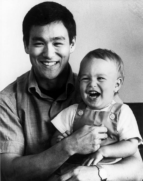 Bruce Lee and his son Brandon in 1966. (Public Domain)