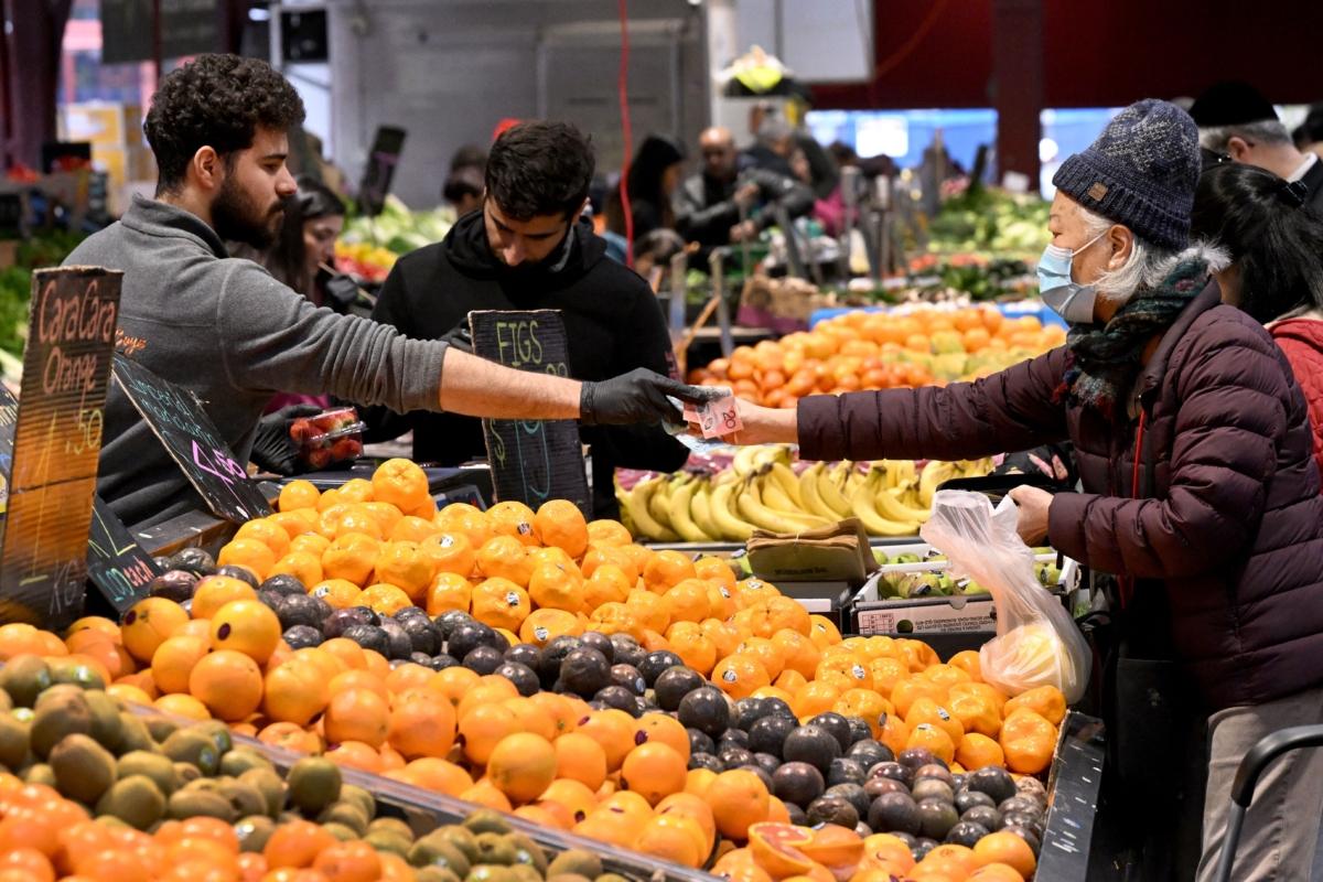 People shop for fresh produce at the Queen Victoria Market in Melbourne, Australia, on July 4, 2023. (William West/AFP via Getty Images)