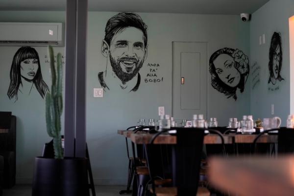 Art depicting Argentine soccer player Lionel Messi adorns the wall at Kao Bar & Grill in Hallandale Beach, Fla., on July 10, 2023. (Rebecca Blackwell/AP Photo)