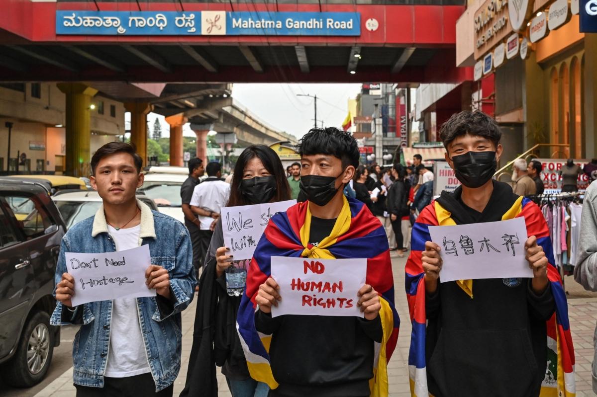 Tibetan youth stage a silent protest as part of ongoing white paper revolution against the zero-COVID policy and China's censorship, in Bengaluru on Dec. 1, 2022. (Manjunath Kiran /AFP via Getty Images)