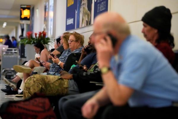 Travelers wait for their flight at Midway International Airport in Chicago, on July 12, 2023. (Nam Y. Huh/AP Photo)