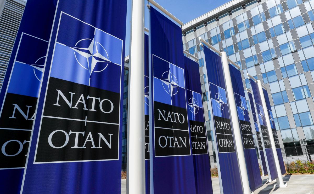 Banners displaying the NATO logo are placed at the entrance of the new NATO headquarters during the move to the new building in Brussels on April 19, 2018. (Yves Herman/Reuters)