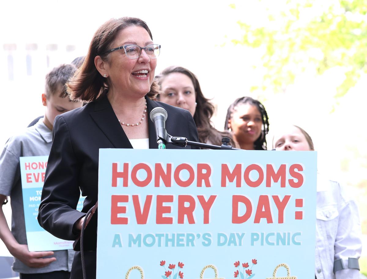 Rep. Suzan DelBene (D-Wash.) joins MomsRising members and their kids at a picnic on Capitol Hill to urge Congress to make childcare affordable, pass paid leave, support care infrastructure, and raise the debt ceiling in Washington on May 17, 2023. (Paul Morigi/Getty Images for MomsRising)