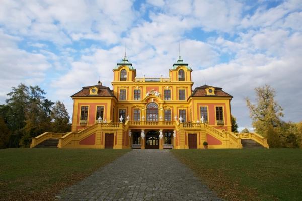 Included as part of Ludwigsburg’s complex, on a nearby hill behind the main building, is a much smaller palace, the Favorite Palace (Schloss Favorite), that was used as a country villa. The Favorite Palace features a yellow façade with turrets and balustrades, French windows, a staircase, and a broad terrace dotted by Greek-inspired statues. (in colors/Shutterstock)