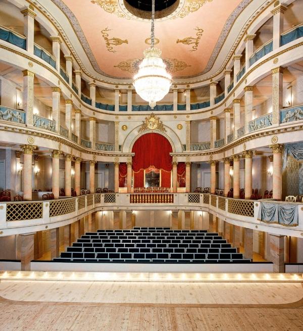 The theater is one of the oldest surviving of its kind in Europe, with original stage machinery from the 18th and 19th centuries. Built in 1750 entirely out of wood, the theater features three tiers of seats, a stage, a series of painted sets, and a red curtain. In 1811, King Friedrich I added some Neoclassical elements, such as the columns and the blue frieze. The background scenery is changed mechanically, and the mechanism, very advanced for its time, still functions. (Joachim Feist/Courtesy of State Palaces and Gardens of Baden-Württemberg)