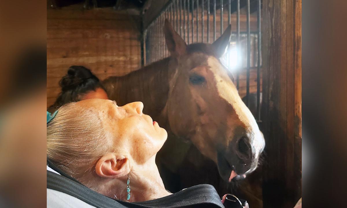 Ms. Courtmanche, 79, reunited with her horse, Bella. (Courtesy of Connecticut Hospice)