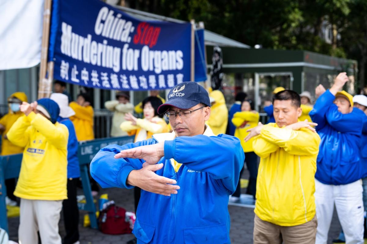 Falun Gong practitioners raise awareness about the persecution of their spiritual practice by the Chinese Communist Party (CCP) in China, outside the U.N. building in New York, on Sept. 24, 2022. (Samira Bouaou/The Epoch Times)