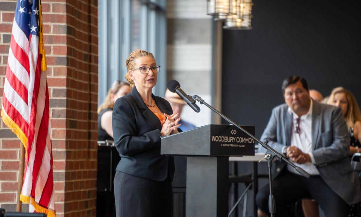 Orange County Chamber of Commerce President Heather Bell-Meyer speaks at a membership meeting at Woodbury Common in Monroe, N.Y., on July 14, 2023. (Cara Ding/The Epoch Times)