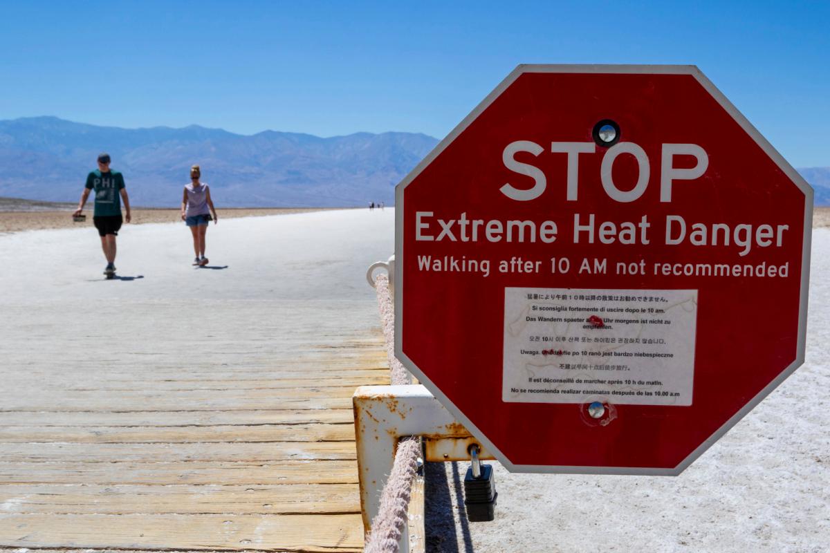 A sign warns people of extreme heat in Death Valley National Park, Calif., on July 11, 2023. (Ty ONeil/AP Photo)