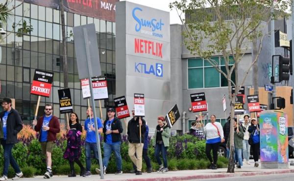  Writers on the picket line on the fourth day of the strike by the Writers Guild of America march past Netflix in Hollywood, Calif., on May 5, 2023. (Frederic J. Brown/AFP via Getty Images)
