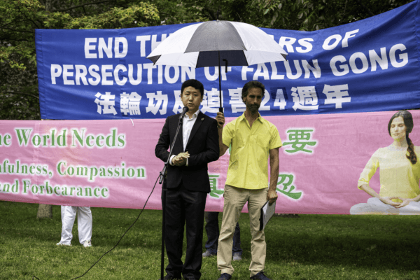 Jiang Jiaji, a representative from Democratic Alliance, a pro-Hong Kong democracy organization, speaks at a rally in support of Falun Gong at Queen's Park in Toronto on July 15, 2023. (Evan Ning/The Epoch Times)