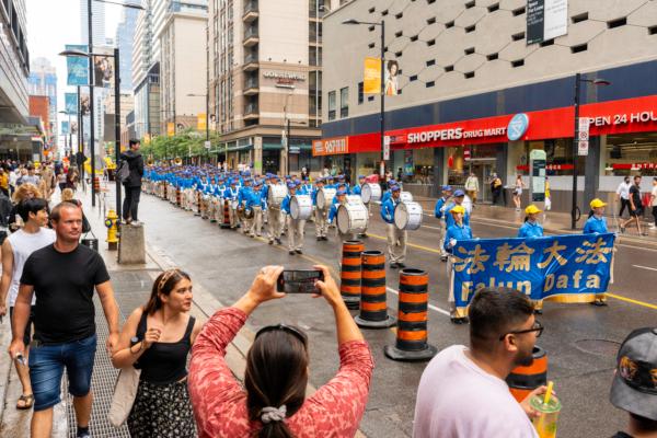 The Tian Guo marching band participated in a parade through downtown Toronto on July 15, 2023, to call on the Chinese regime to end its persecution of Falun Gong. (Evan Ning/The Epoch Times)