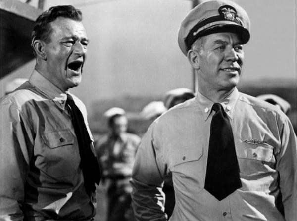 On the deck with Lt. Cmdr. Duke E. Gifford (John Wayne, L) and Cmdr. John T. “Pop” Perry (Ward Bond) in “Operation Pacific.” (Warner Bros.)