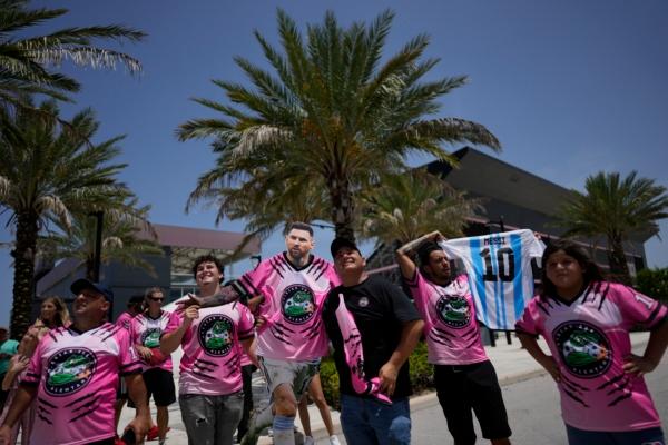 A group of South Florida fans waits outside DRV Pink Stadium, home of Inter Miami MLS soccer club, in hopes of catching a glimpse of Argentine soccer superstar Lionel Messi in Fort Lauderdale, Fla., on July 11, 2023. (Rebecca Blackwell/AP Photo)