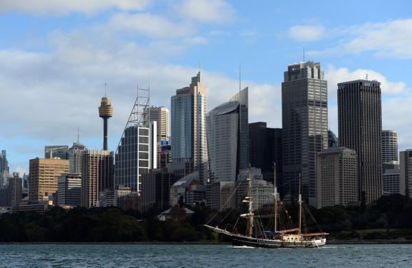 A boat sails in front of the skyline in Sydney, Australia on May 2, 2013. (Saeed Khan/AFP via Getty Images)