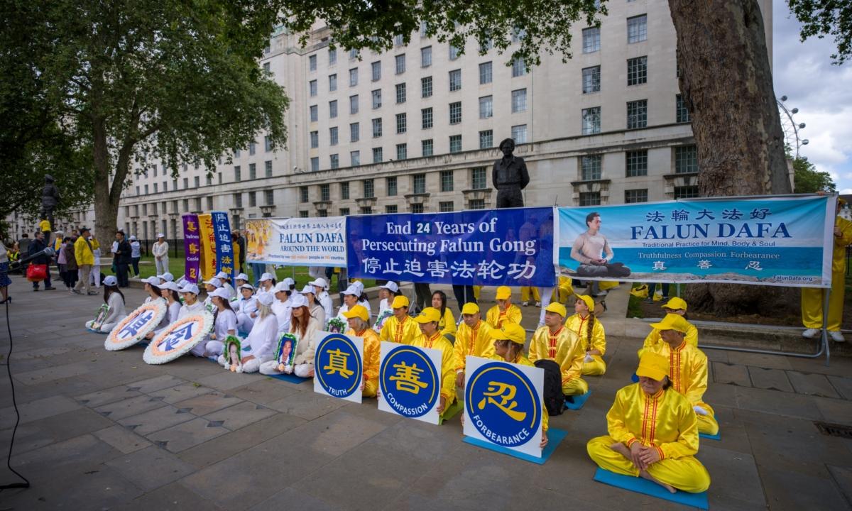 Falun Gong practitioners hold a rally marking the 24th anniversary of the CCP's persecution, in London on July 15, 2023. (Yanning Qi/The Epoch Times)