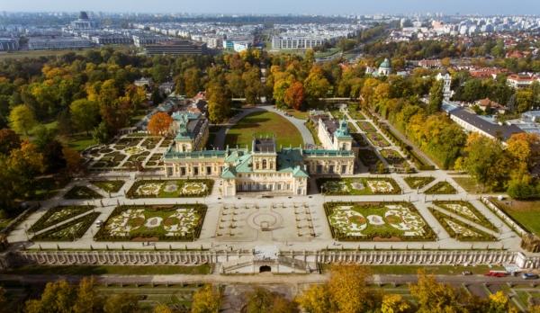 An aerial view of Warsaw’s Baroque Wilanow Palace, where Polish royals once lived. Visitors to the Baroque palace can enjoy a stroll through the vast grounds and myriad garden styles, including Italian, English, and Chinese. (<a href="https://www.shutterstock.com/image-photo/top-view-wilanow-royal-palace-warsaw-1204214506">Stock video production</a>/Shutterstock)