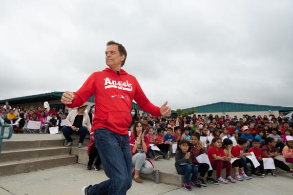 Sports talk show host Roger Lodge interacts with students at an Angels Adopt-A-School event at Orange Grove Elementary in Anaheim, Calif., on May 23, 2023. (Courtesy of Angels Radio AM 830)