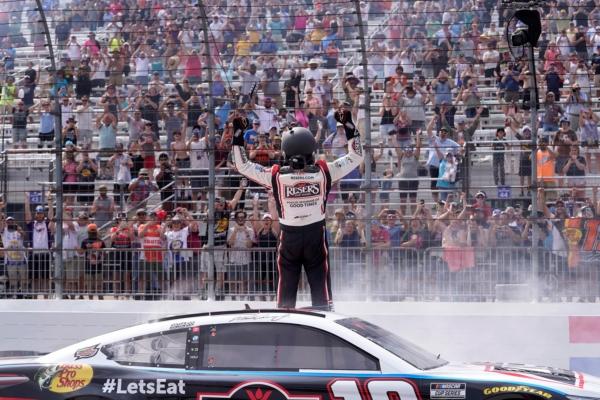 Martin Truex Jr. celebrates after winning the Crayon 301 NASCAR Cup Series race at New Hampshire Motor Speedway in Loudon, N.H., on July 17, 2023. (Steven Senne/AP Photo)