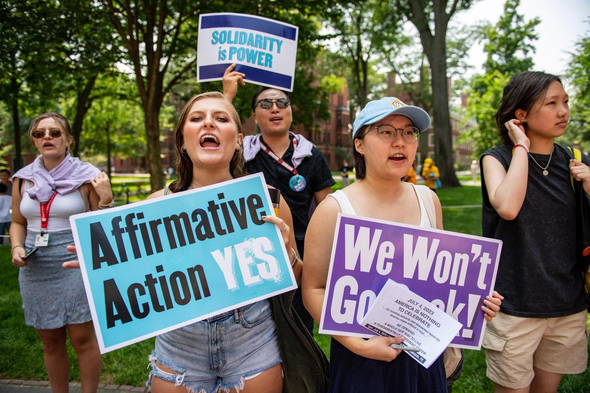 Proponents of affirmative action hold signs during a protest at Harvard University in Cambridge, Mass., on July 1, 2023. (Joseph Prezioso/AFP via Getty Images)