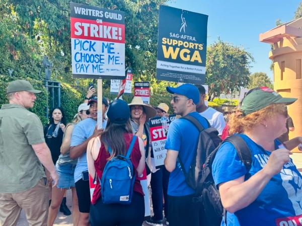 Members of the Writer’s Guild of America and Screen Actors Guild-American Federation of Television and Radio Artists (SAG-AFTRA) picket together outside Disney Studios in Burbank, Calif., on July 18, 2023. (Jill McLaughlin/The Epoch Times)
