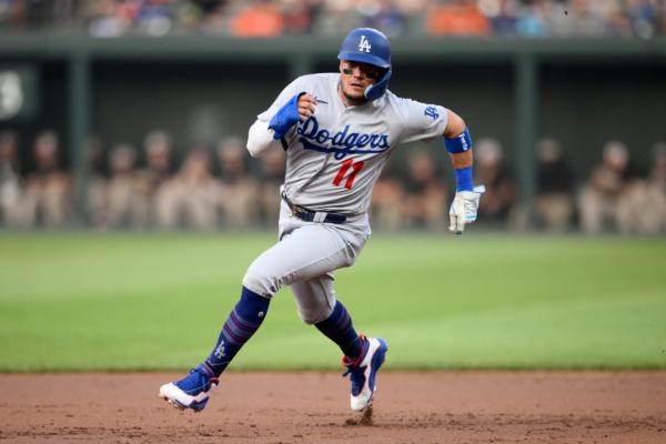 Los Angeles Dodgers' Miguel Rojas runs towards third on a single by James Outman during the second inning of a baseball game against the Baltimore Orioles in Baltimore on July 18, 2023. (Nick Wass/AP Photo)