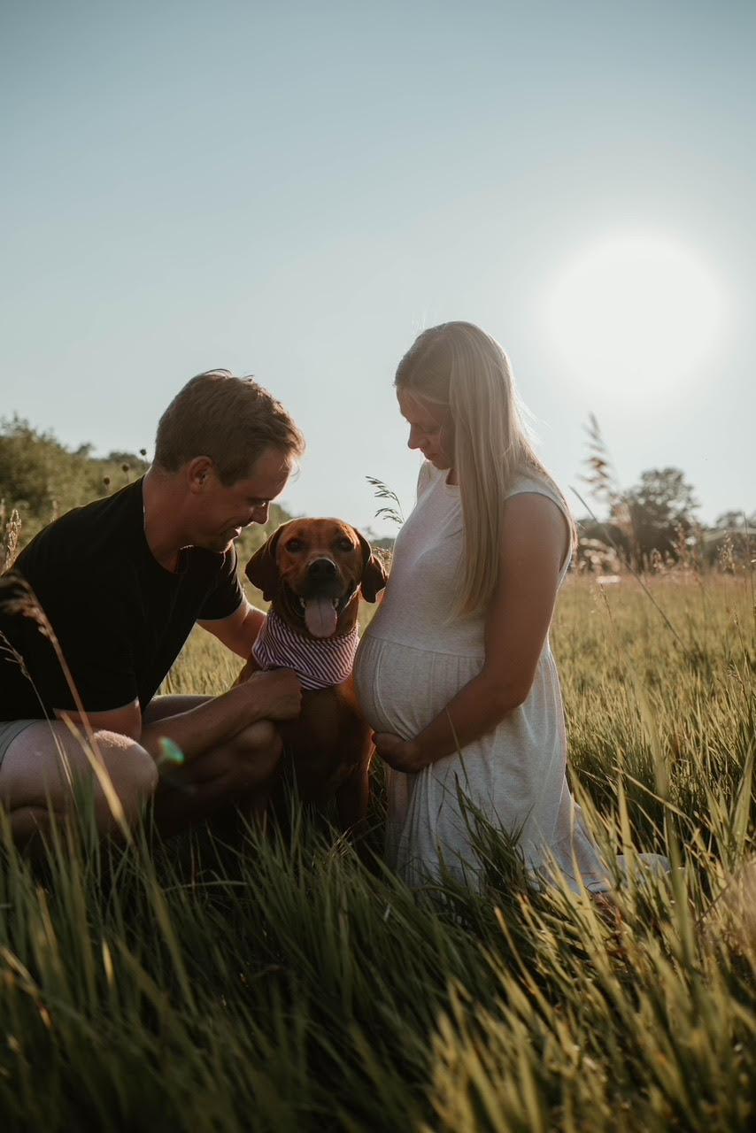 Ms. Sutton with her husband, Dylan Sutton, and their dog. (Courtesy of Wildfire Photo Co.)
