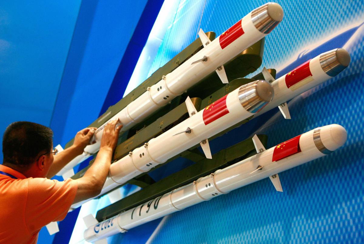 An exhibitor prepares Chinese-made TY-90 IR missile models displayed on the opening day of the China Aviation Expo 2007 in central Beijing, on Sept. 19, 2007. (Teh Eng Koon /AFP via Getty Images)