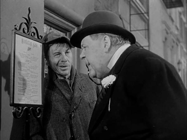 A vagrant friend (David Wayne, L) and Soapy (Charles Laughton) review a menu. (20th Century Fox)