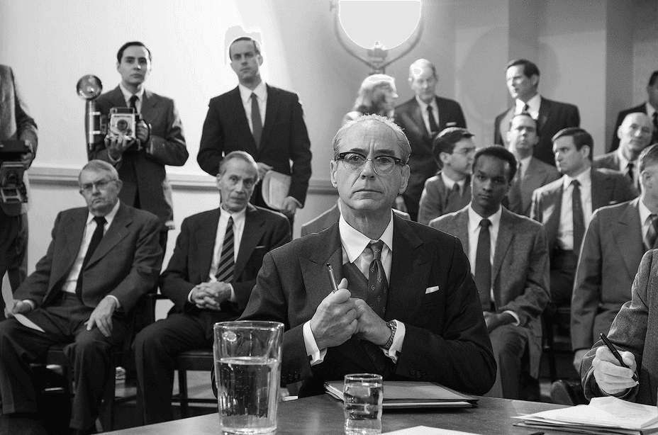 Rear Adm. Lewis Strauss (Robert Downey Jr., front C) at a Senate confirmation hearing, in "Oppenheimer." (Universal Pictures)
