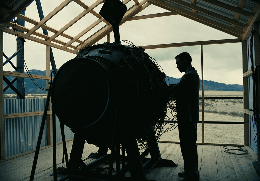 Julius Robert Oppenheimer (Cillian Murphy) inspects a test-run atomic bomb, in "Oppenheimer." (Universal Pictures)