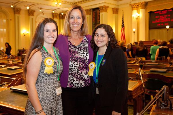 Gold Award recipients Piper Ireland (L) and Clare Madera (R) of Girl Scouts of Greater Los Angeles pose for a photo with Assemblywoman Jacqui Irwin, D-Thousand Oaks, at the California State Capitol in Sacramento on June 22, 2016. (Kelly Sullivan/Getty Images for Girl Scouts)
