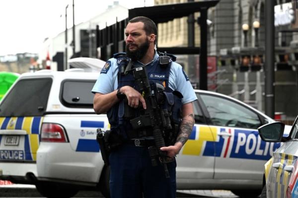A police officer cordons off an area near the site of a shooting in central Auckland, New Zealand, on July 20, 2023. (Saeed Khan/AFP via Getty Images)